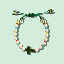 Load image into Gallery viewer, Close-up of a Freshwater Pearl Green Cross Bracelet with adjustable closure.
