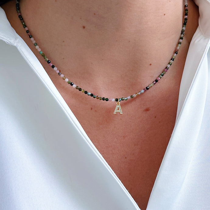 Tourmaline Gemstone Initial Necklace featuring colorful gemstones and a sparkling initial charm with CZ accents, perfect for a unique and meaningful look.