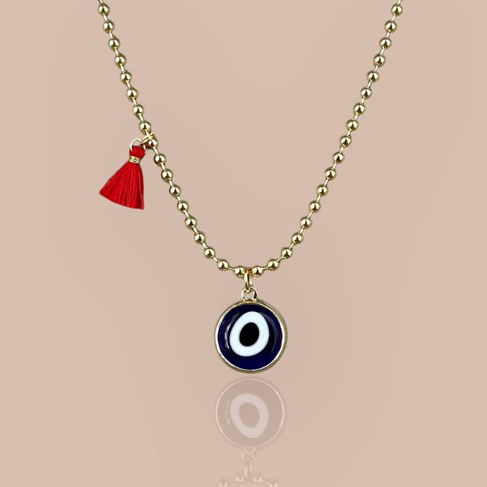 Blue beaded necklace featuring a Murano glass evil eye pendant set in 18k gold plated chain, symbolizing protection and elegance.