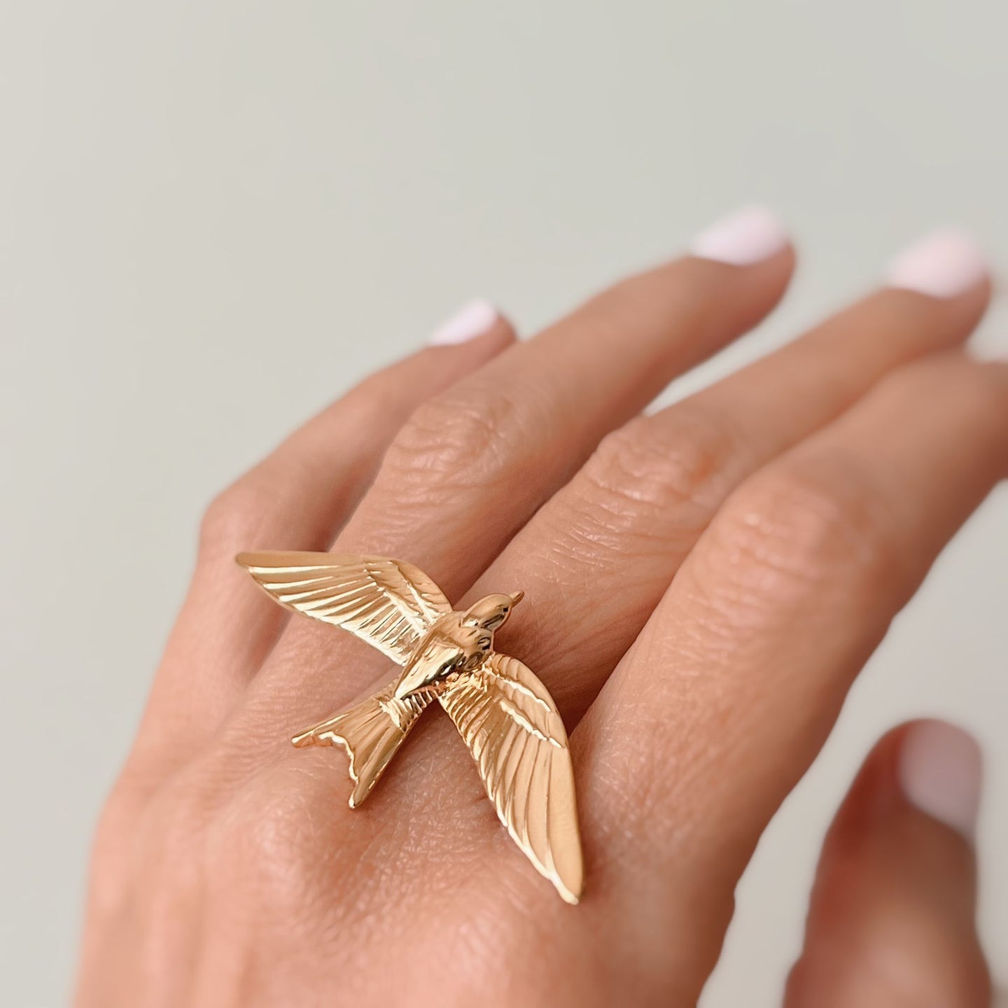 Seagull open ring made from 18k gold plated over stainless steel, showcasing a nature-inspired design.