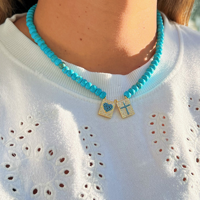 Close-up of CZ Scapular Turquoise Bead Necklace with cross and heart charms.