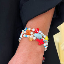 Load image into Gallery viewer, Model wearing freshwater pearl bracelet with adjustable sliding closure.
