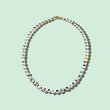 Load image into Gallery viewer, Close-up of 17&quot; Be Nice Freshwater Pearl Necklace with &quot;Be F*cking Nice&quot; text.
