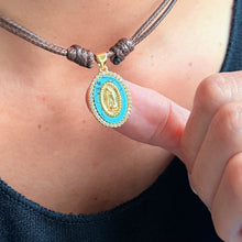 Load image into Gallery viewer, Gold-tone religious charm with turquoise center stone and CZ accents
