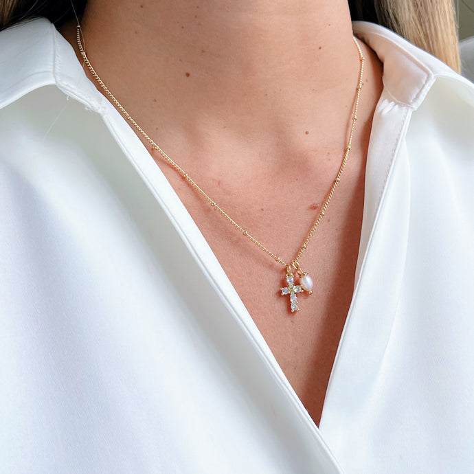 Cross Necklace featuring a delicate cubic zirconia cross with a freshwater pearl pendant, elegant and perfect for any occasion.