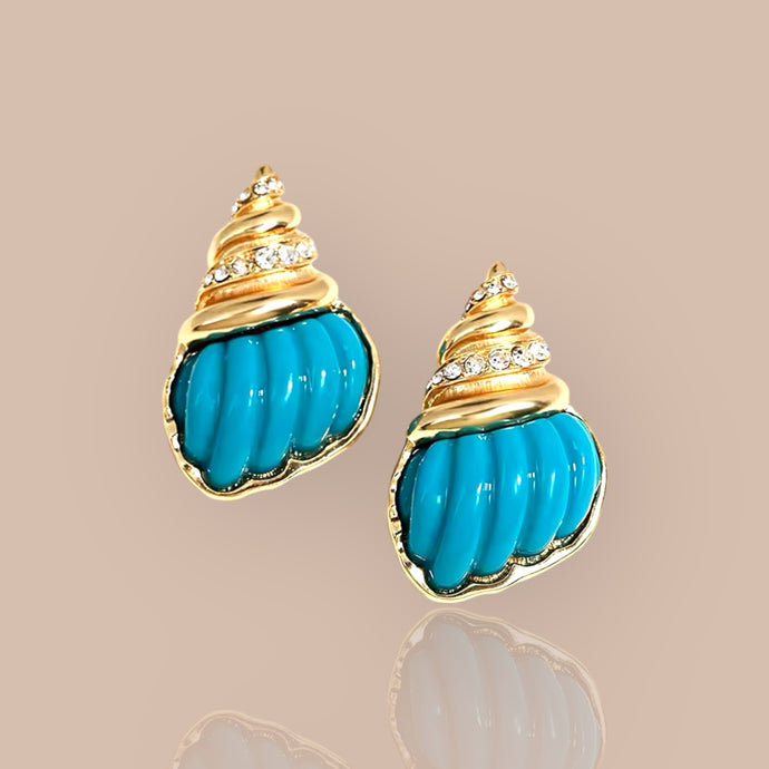 Exaggerated turquoise seashell earrings showcasing vibrant colors and intricate designs, perfect for a bold fashion statement.