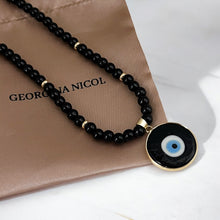 Load image into Gallery viewer, Black Onyx Bead Necklace with a Turkish Evil Eye charm in black glass, combining style and symbolism.
