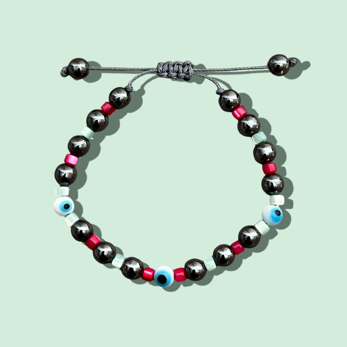 Close-up of Evil Eye Hematite Beaded Bracelet with pink and mint beads.