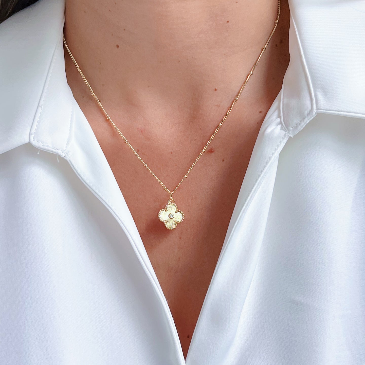 Handcrafted Clover Necklace featuring a four-leaf clover charm symbolizing luck, positivity, and fortune. Elegant and meaningful jewelry.