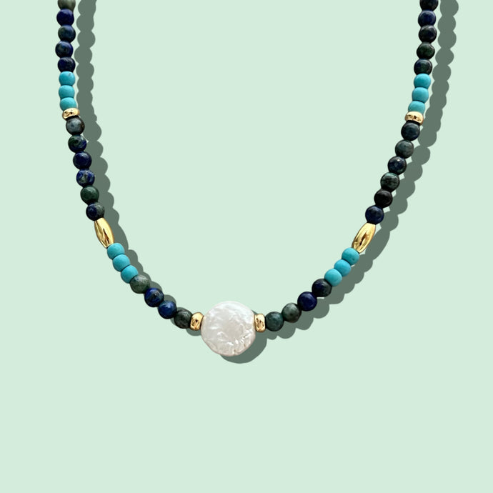 Close-up of the Pearl Coin Bead Necklace.