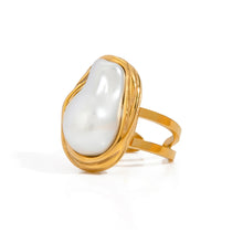 Load image into Gallery viewer, Baroque pearl ring worn on hand, emphasizing its elegant and timeless appeal.
