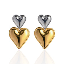 Load image into Gallery viewer, Elegant double heart earrings in gold and silver, showcasing the contrast
