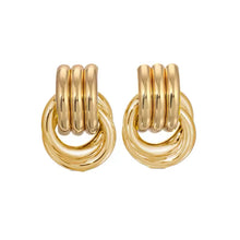 Load image into Gallery viewer, Close-up of lightweight gold open circle earrings, hypoallergenic and tarnish-resistant.
