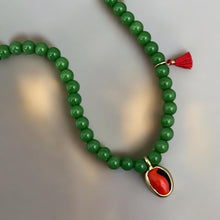 Load image into Gallery viewer, Close-up of green gemstone and peony charm necklace
