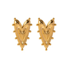 Load image into Gallery viewer, Close-up of large gold heart earrings, lightweight and shiny finish.
