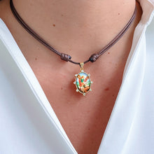 Load image into Gallery viewer, Model wearing Archangel Michael brown cord necklace, a symbol of strength and protection.
