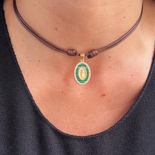 Load image into Gallery viewer, Model wearing a malachite religious choker necklace, perfect for layering
